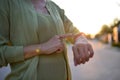 Close up shot of a woman checking time on her smartwatch. Royalty Free Stock Photo