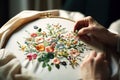 Close up shot of woman hands doing flower embroidery. Unrecognizable person.