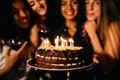 Close up shot of woman holding birthday cake