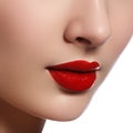 Close-up shot of woman lips with glossy red lipstick. Glamour red lips make-up, purity skin. Retro beauty style. Beautiful model Royalty Free Stock Photo