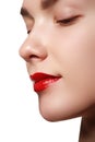 Close-up shot of woman lips with red lipstick. Beautiful perfect Royalty Free Stock Photo