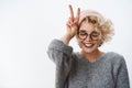 Close-up shot of woman loving winter and holidays having fun feeling happy and tender close eyes joyful wearing beanie Royalty Free Stock Photo