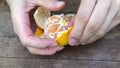 Woman peeling a mandarin.