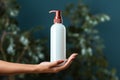 Close up shot Woman presents a liquid soap bottle with ample copy space