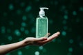 Close up shot Woman presents a liquid soap bottle with ample copy space