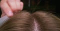 Woman`s hair being combed