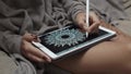 Woman drawing on a tablet