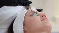 Cosmetologist providing facial skin therapy with YAG laser