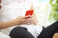 Cropped shot of young woman`s hand with her mobile phone Royalty Free Stock Photo