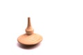Close up shot of a wooden spinning top moving
