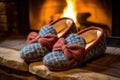 close-up shot of woolen slippers by a roaring fireplace