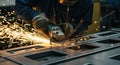 Metalworker Grinding Metal with Sparks Flying, Industrial Manufacturing Royalty Free Stock Photo