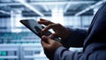 Close up shot of worker in server room using tablet Royalty Free Stock Photo