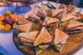 Close up shots of assorted sandwich triangles on a catering party platter. Royalty Free Stock Photo