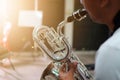 Close-up shots of musicians playing Baritone Saxophone In the music practice room, blurred background