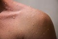 Close up shoulder of man which take a shower. Royalty Free Stock Photo