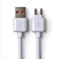 White usb and audio jack cables on a plain surface view Royalty Free Stock Photo