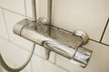 Close-up of shower mixer faucet with limescale, white chalky deposit and stains. Formed on the plumbing system by a Royalty Free Stock Photo