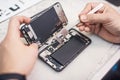 Close-up, showing process of mobile phone repair at service center Royalty Free Stock Photo