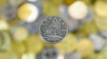 A close-up shows one 10-cent coin. This is money. Blurred money background. Dime, the smallest 0.10 Canadian dollar coin. The Royalty Free Stock Photo