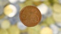 A close-up shows one 5 euro cent coin. This is money. Blurred money background. Changeable circulating coin of the Eurozone