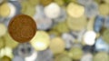 A close-up shows one 5 euro cent coin. This is money. Blurred money background. Changeable circulating coin of the Eurozone