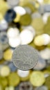 A close-up shows one 1 French franc coin from 1961. This is money. Blurred money background. Sower type. Mint - Paris. Made from Royalty Free Stock Photo