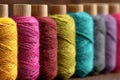 Close-up shows a row of colorful spools of thread, capturing the textile artistry and craftsmanship inherent in sewing and Royalty Free Stock Photo