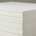 A close-up shows a stack of white sheets, likely made of paper or thin cardboard, neatl Royalty Free Stock Photo