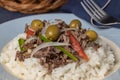 Close up of shredded meat with rice and olives, typical Cuban food