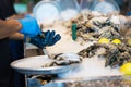 Close-up of shucking oysters Royalty Free Stock Photo