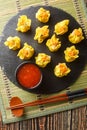 Close Up of Shumai or Shaomai or Siu Mai or Siomay is a type of traditional Chinese Steamed Dumpling served with chili sauce on Royalty Free Stock Photo