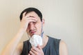 Close up of a sick man closing his eyes. Man removes the protective medical mask from his face Royalty Free Stock Photo