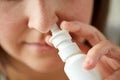 Close up of sick woman using nasal spray Royalty Free Stock Photo