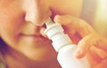 Close up of sick woman using nasal spray Royalty Free Stock Photo