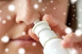 Close up of sick woman using nasal spray Royalty Free Stock Photo