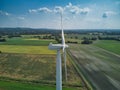 close up side aerial view of a rural wind turbine in the English countryside Royalty Free Stock Photo