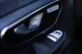 Close-up of the side door buttons: window adjustment buttons, door lock. modern car interior: parts, buttons, knobs Royalty Free Stock Photo