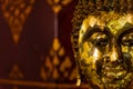 Close up of side face of grunge golden Buddha statue. Symbol of religion buddhism spirituality asian culture traditional.