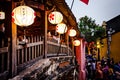 Close up from the side of the famous Japanese bridge in Hoian ancient town with lanterns and tourists walking across.. Hoi An, Royalty Free Stock Photo