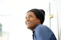 Close up side of handsome young black man smiling and looking away