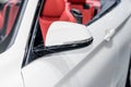 Close up of side mirror of white car with turn signal. Royalty Free Stock Photo