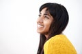 Side portrait of cheerful young Indian woman against isolated white background Royalty Free Stock Photo