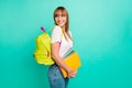 Close up side profile photo beautiful she her lady look empty space arms hands school colored notebooks modern backpack