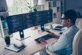 Close up side profile photo of professional young guy it specialist create code looking two modern monitors typing