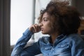 Closeup face African sad thoughtful teenager girl looking into distance Royalty Free Stock Photo