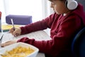 Close up side view of boy doing math homework Royalty Free Stock Photo