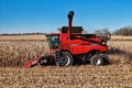 Close up side view of a Case 6140 harvester combining corn Royalty Free Stock Photo