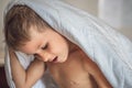 Close-up side view child caucasian boy head grey hair stick out from white blanket in bedroom. Quality sleep time or