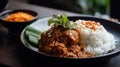 Close-up side view of delicious rendang food on a plate. Beautifully designed and created